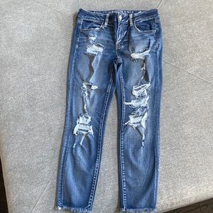 Ripped jeans. Crop length.